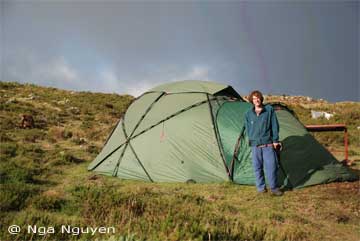 Peter outside his tent at camp